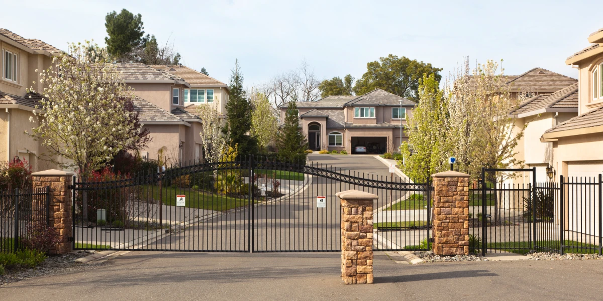 What are the pros and cons of gated communities?