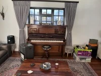 Old Leipzig piano with candle holder