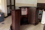 Bar counter with display case and 5 chairs