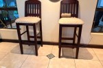 Bar counter with display case and 5 chairs