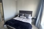 Queen bed, headboard, 3 seater couch, medium table, desk