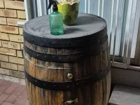 Garden pots with plants, bird cage, barrel, wheel barrow