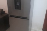 2 beds, fridge, couches, washing machine, TV, clothes, stove