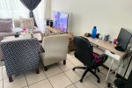 Bed and side tables, Round glass dinner table, couch, living room side...