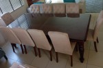 10 seater dining room table with a glass top, 10 dining chairs (10)