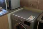 Corner sofa, table and 4 chairs, fridge, washing machine, 2 single bed...