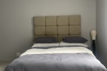 Double bed, fridge, microwave, small 2 seat table