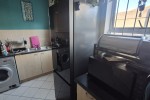 Queen bed, Standard Fridge, Microwave, Plant shelf, Table, Plant shelf...