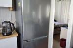 Single door fridge, Small box freezer, Occasional table, Occasional ta...