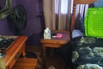 Queen size bed, dresser, drawers, side table, small desk and self with...