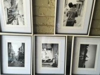 4 prints with wooden frames and glass A3 size., 3 puzzles in wooden fr...