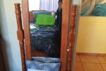 Queen size bed, dresser, drawers, side table, small desk and self with...
