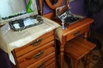 Queen size bed, dresser, drawers, side table, small desk and self with...