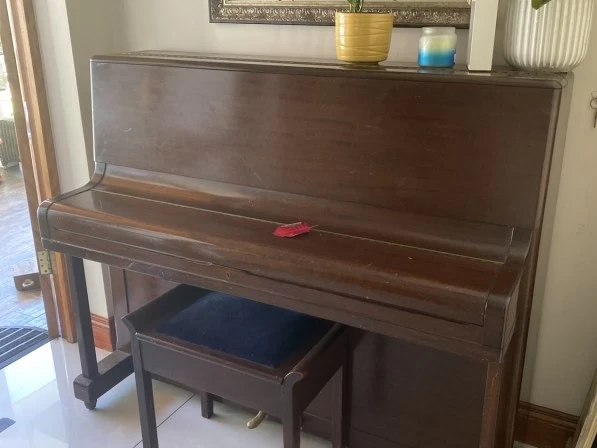Upright steel frame piano