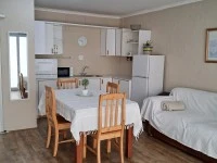Single bed, fridge, 6 seat table, lazy boy chair