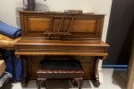 Antique brown wood piano