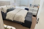 Bed and side tables, Round glass dinner table, couch, living room side...