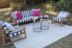 Patio furniture, one three sitter and two one sitter large wooden chai...