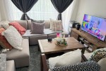 Bed and side tables, Round glass dinner table, couch, living room side...