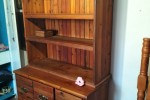 Queen size bed, dresser, drawers, side table, small desk and self with...