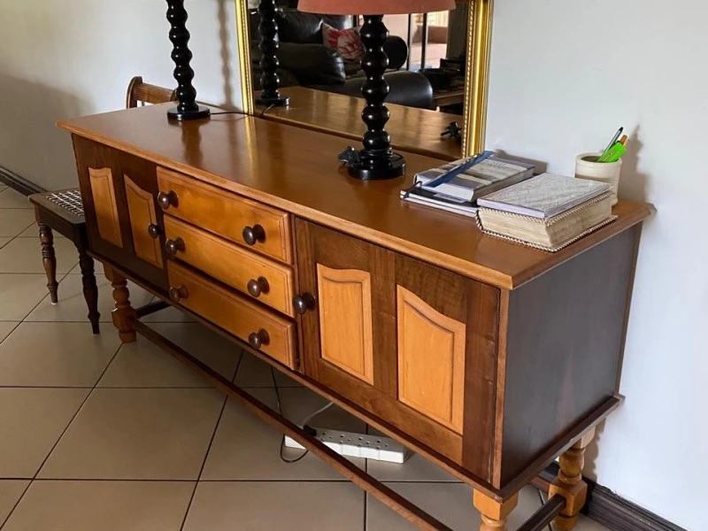 Dining room table and cupboard.