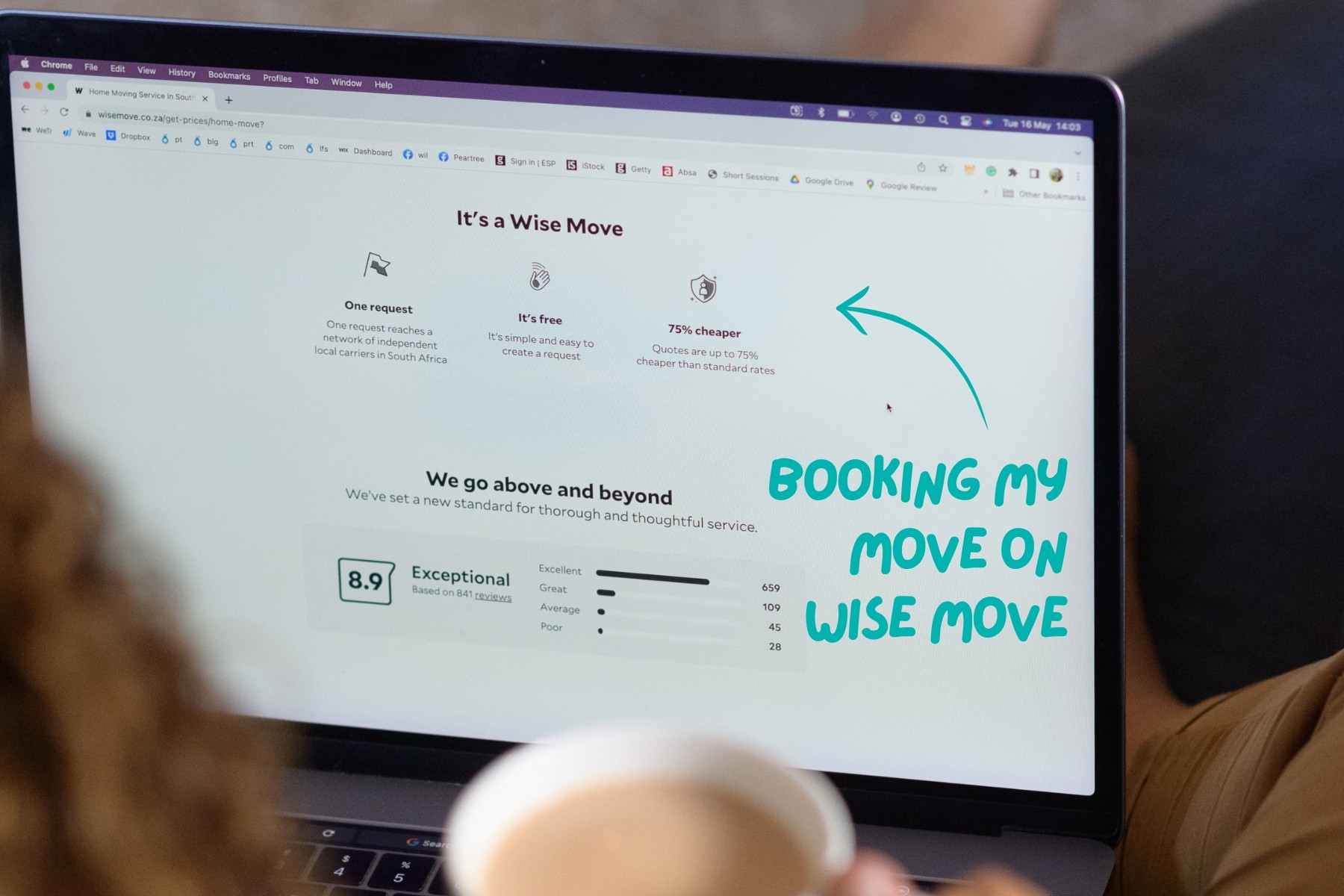 Woman sitting with laptop booking her move on Wise Move website