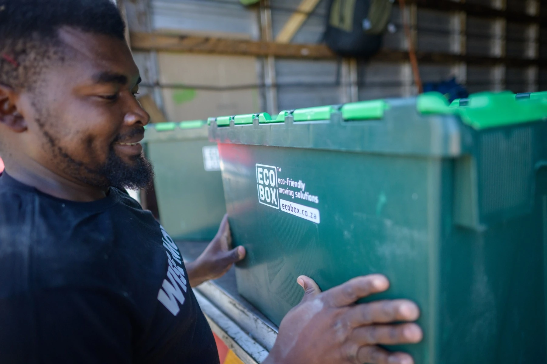 Professional mover moving valuable artwork in crate