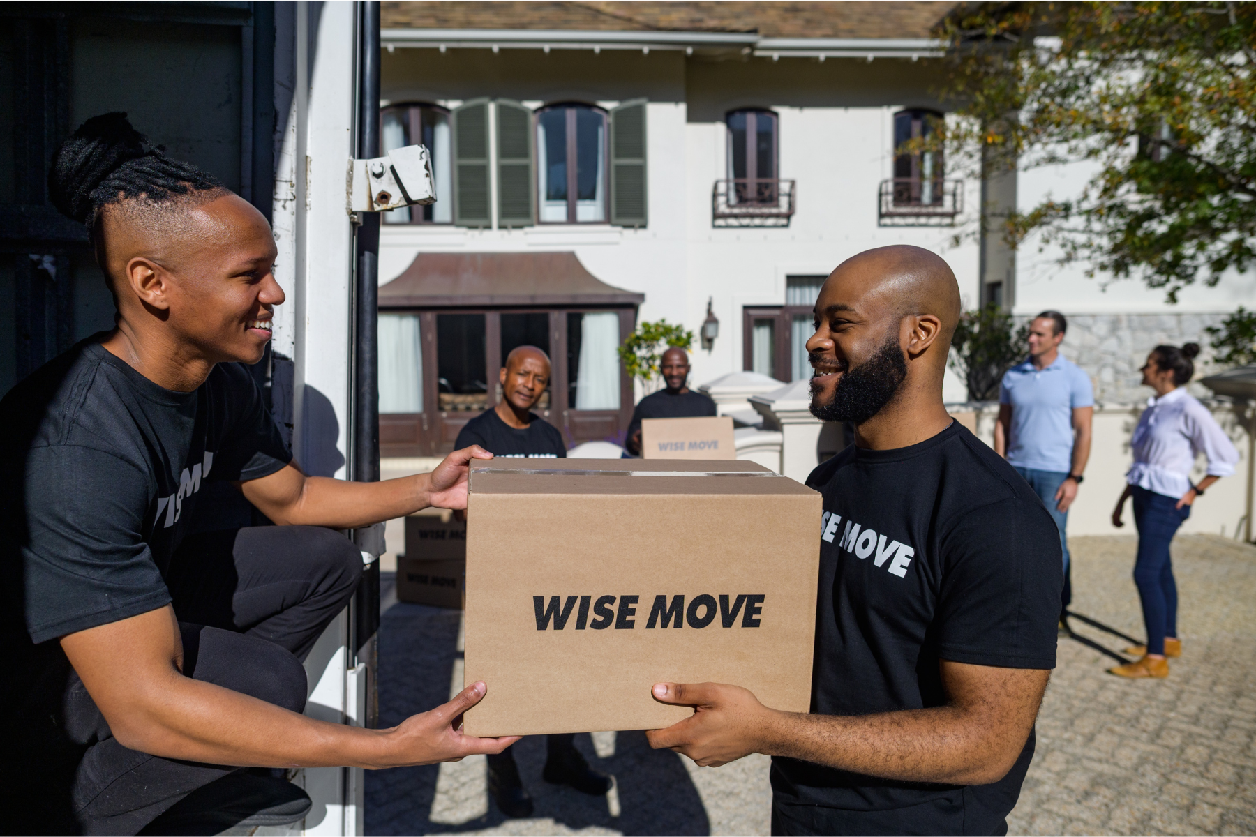 Wise Move team meeting packing boxes into moving truck in Bryanston