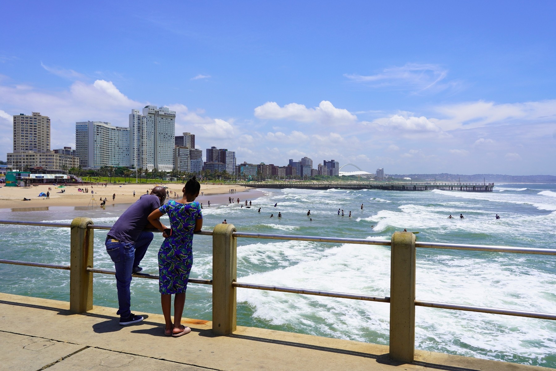 Couple overlooking Durban beach in summer
