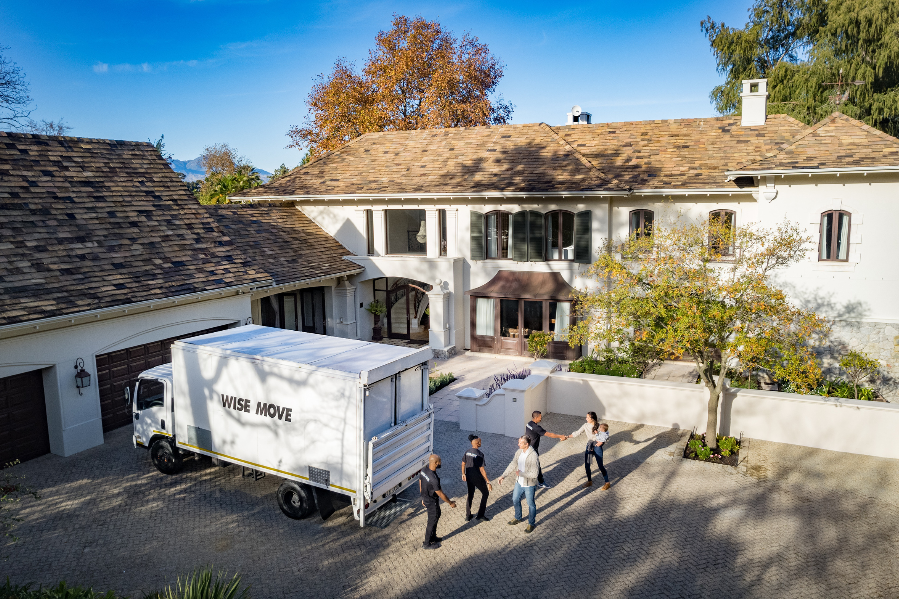 Family welcoming Wise Move moving team