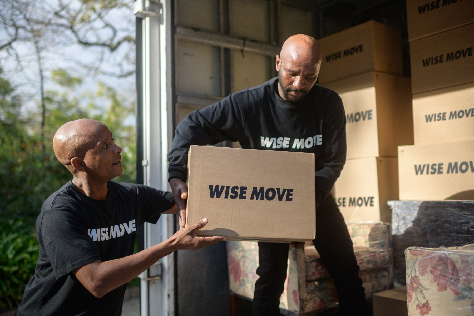 Wise Move moving team loading moving truck with boxes