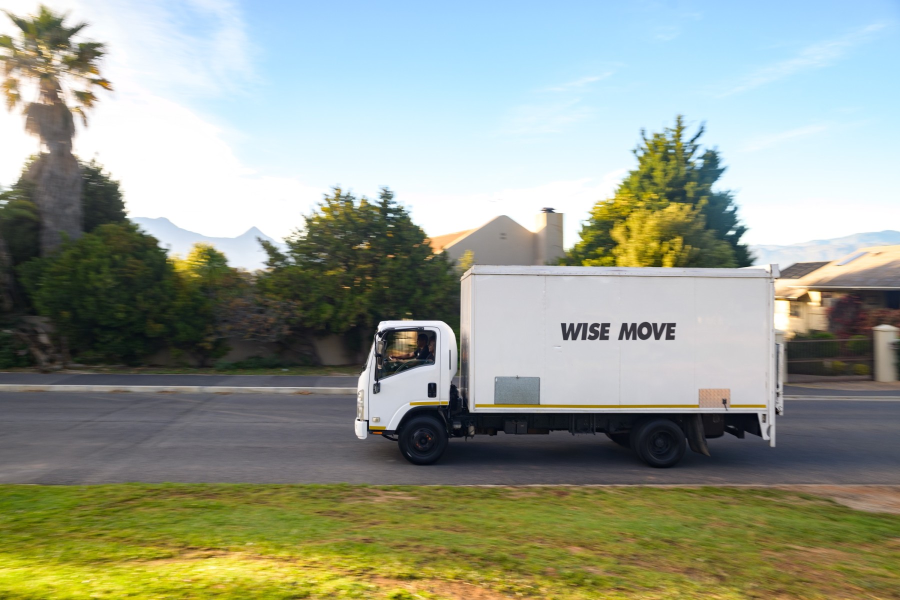 Enclosed truck transporting art in South African summer