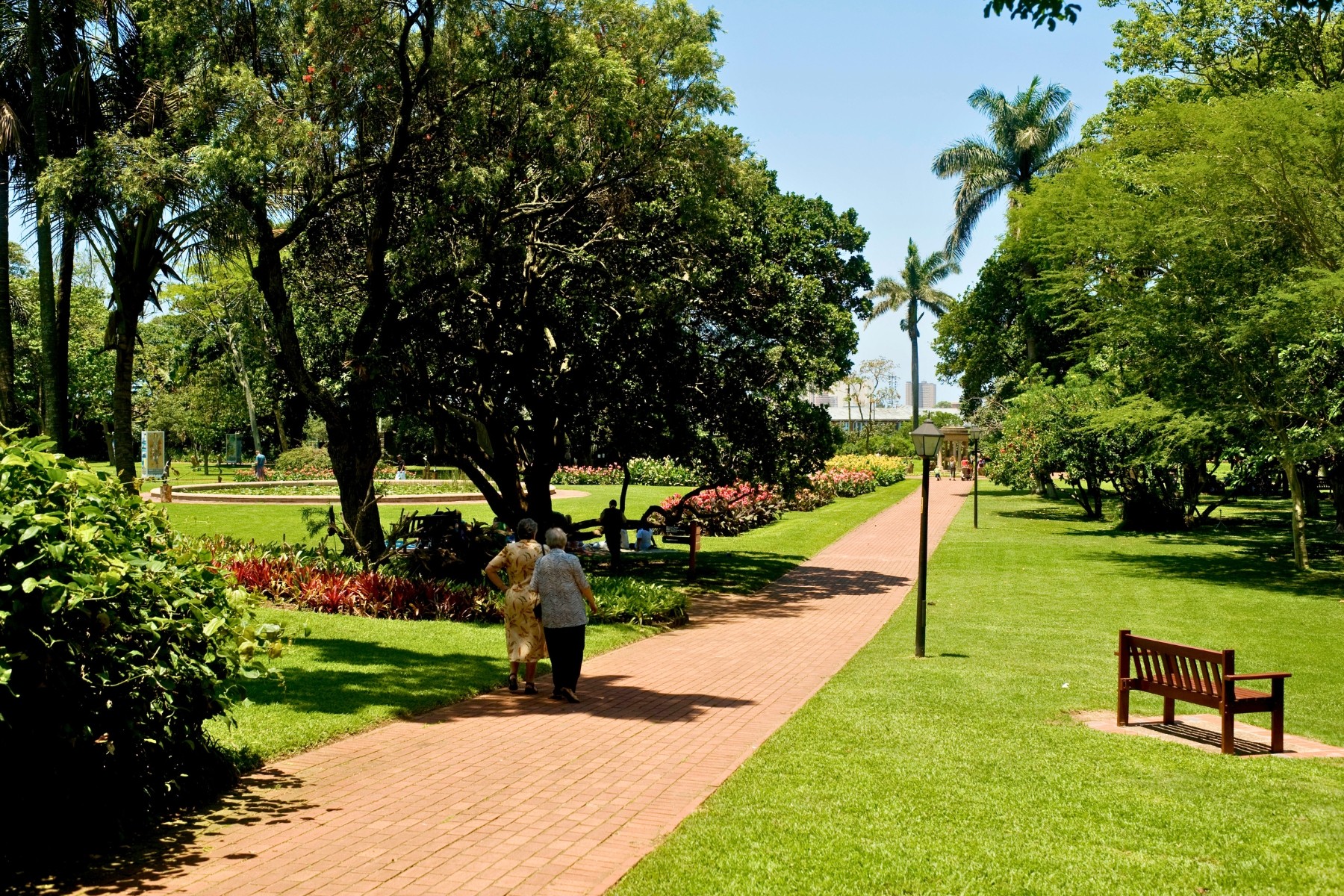 Elderly women enjoying autumn flowers in Durban
