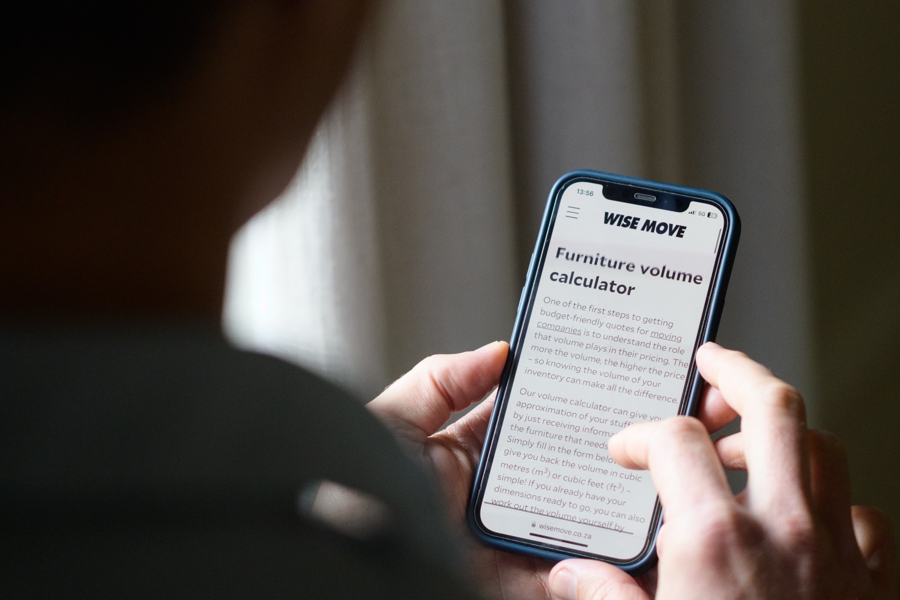 Man calculating volume of move using Wise Move's furniture volume calculator