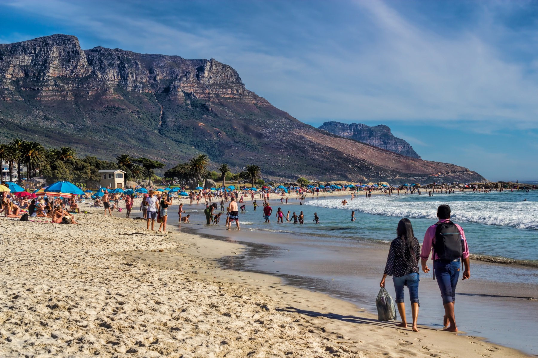 Summer beach day in Cape Town with clear skies and blue water