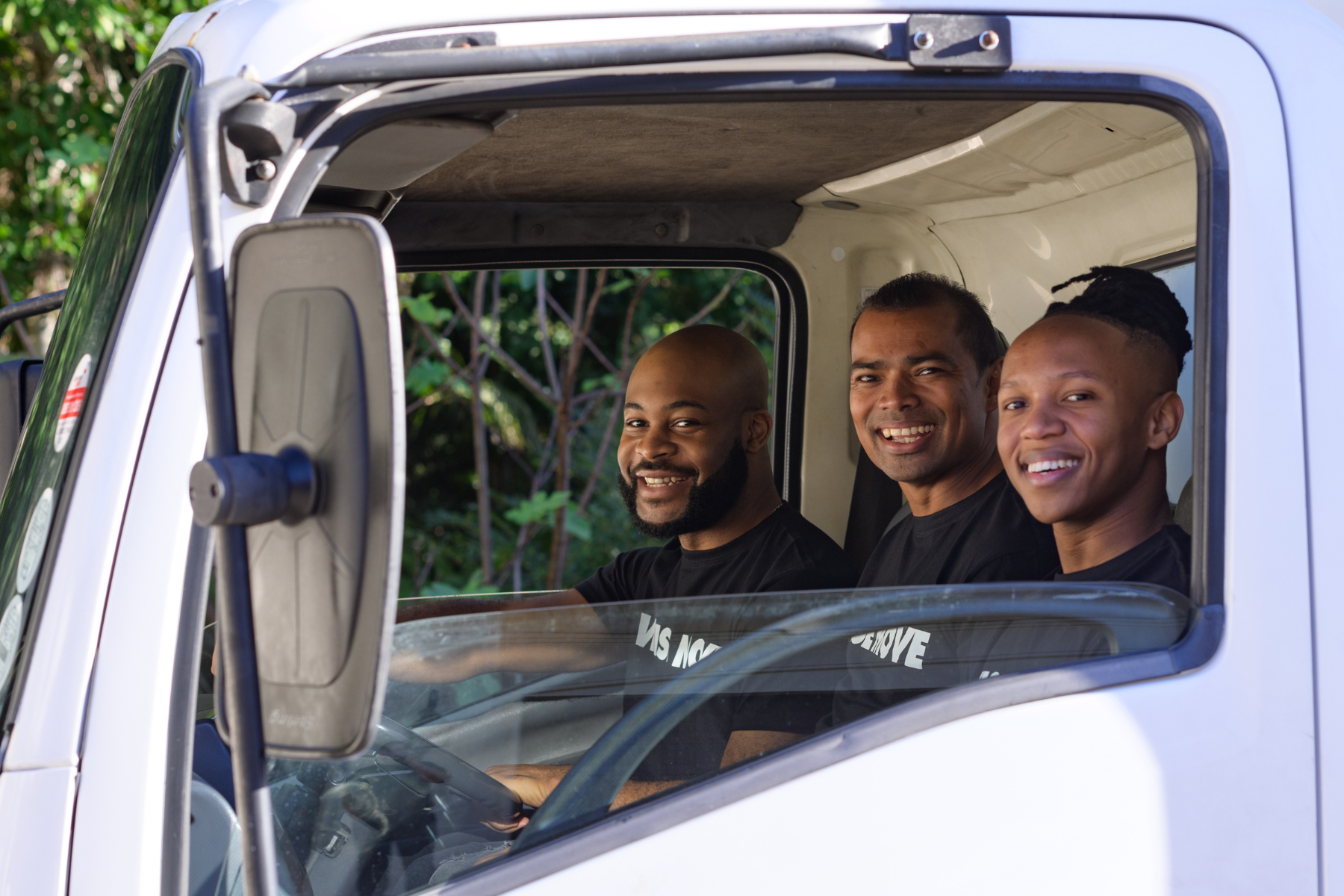 Friendly Wise Move moving team sitting in moving truck